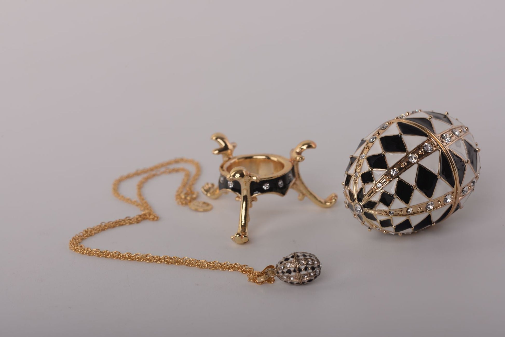Keren Kopal Black and White Faberge Egg with Gold Necklace Inside