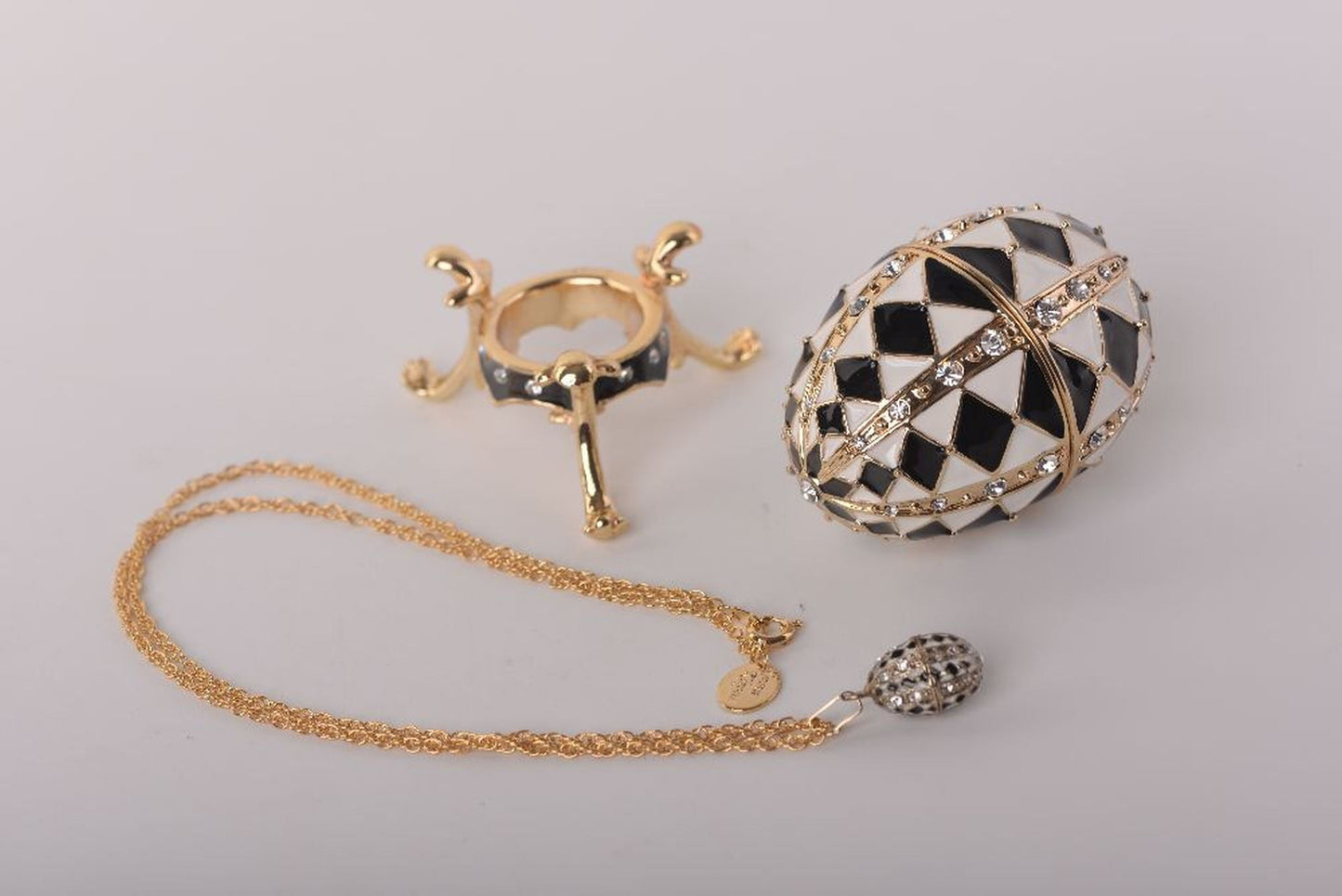 Keren Kopal Black and White Faberge Egg with Gold Necklace Inside