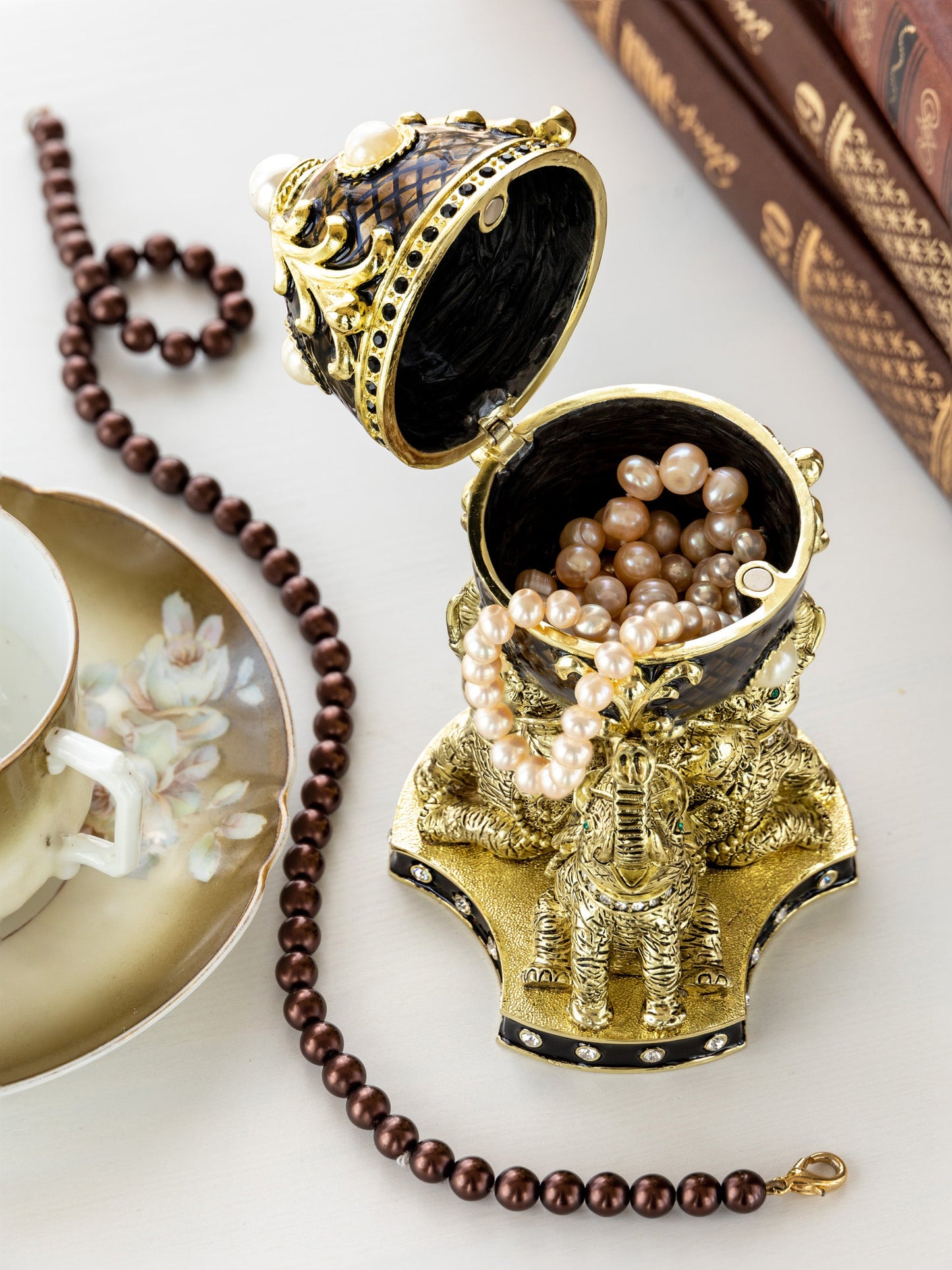 Regal Brown and Gold Enamel Egg with Elephant Pedestal