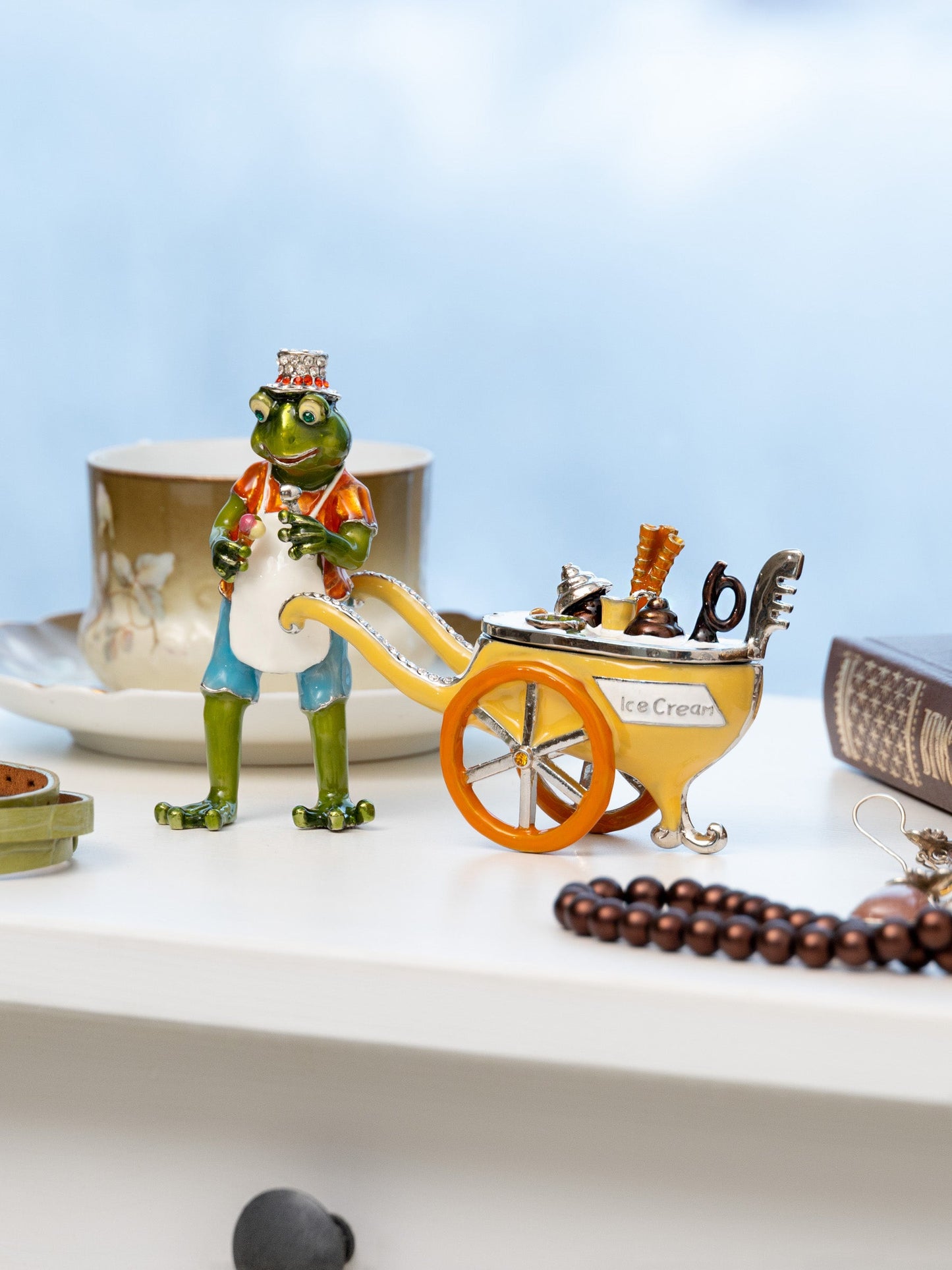 Keren Kopal Frog ice cream seller with a colorful ice cream cart